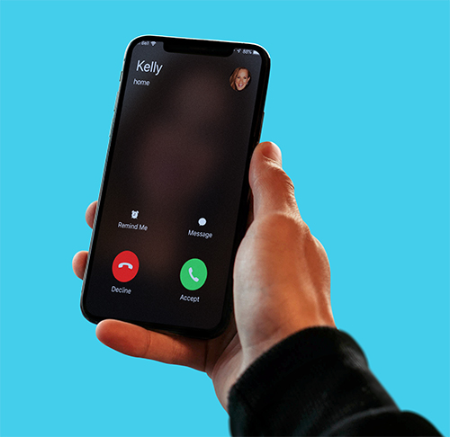 Man holding phone with an incoming call