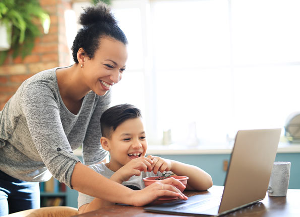 Mother and child using a laptop connected to Fongo Internet