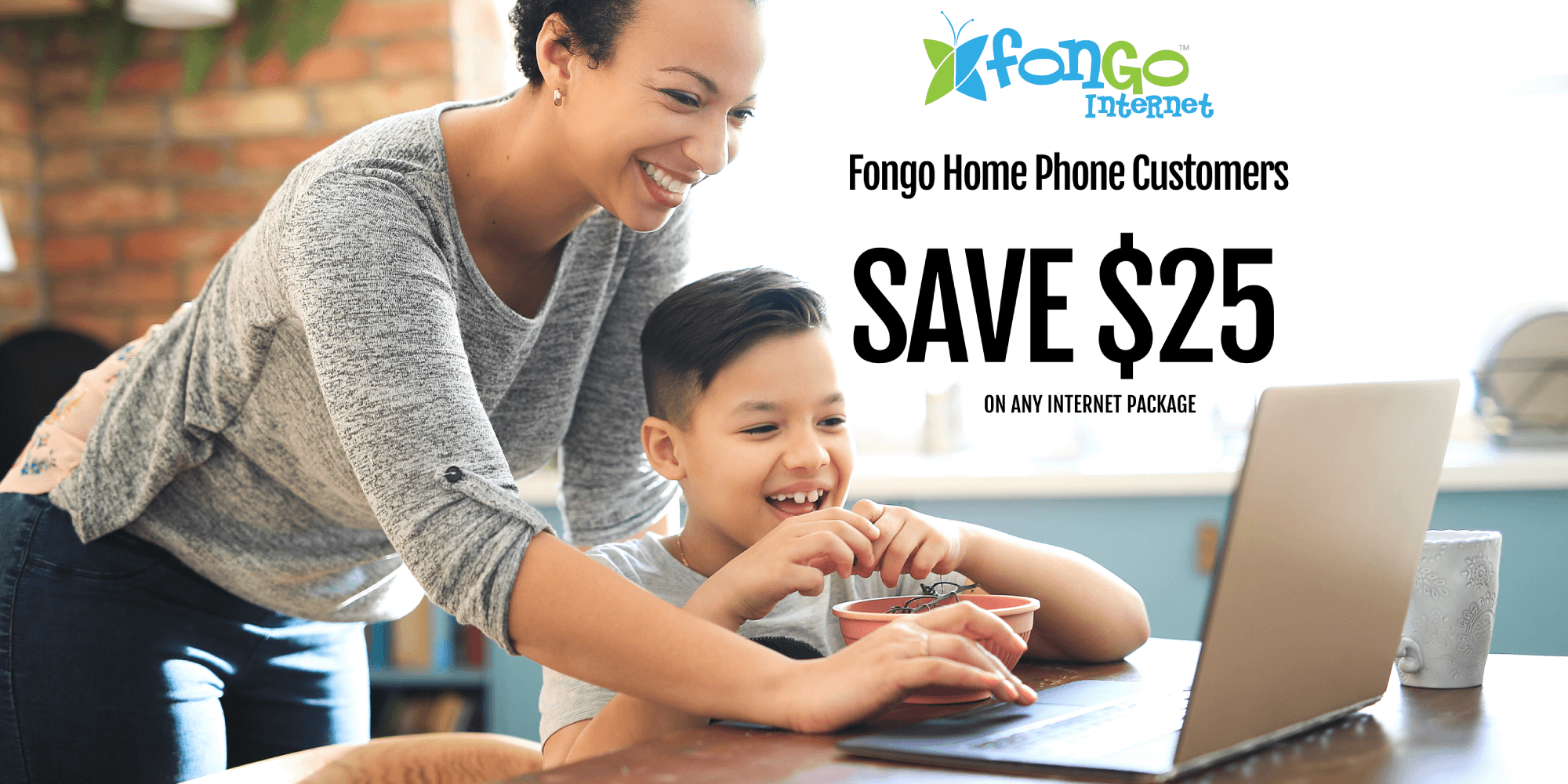Fongo Home Phone customer save $25 on Fongo internet packages. Mother at the kitchen table with her son, happily using a computer together.