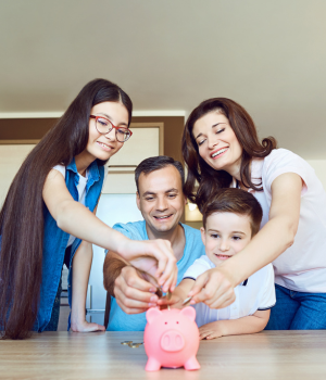 Parents and two children placing money into piggy bank because they are saving money on their kid's first cell phone that includes talk and text.