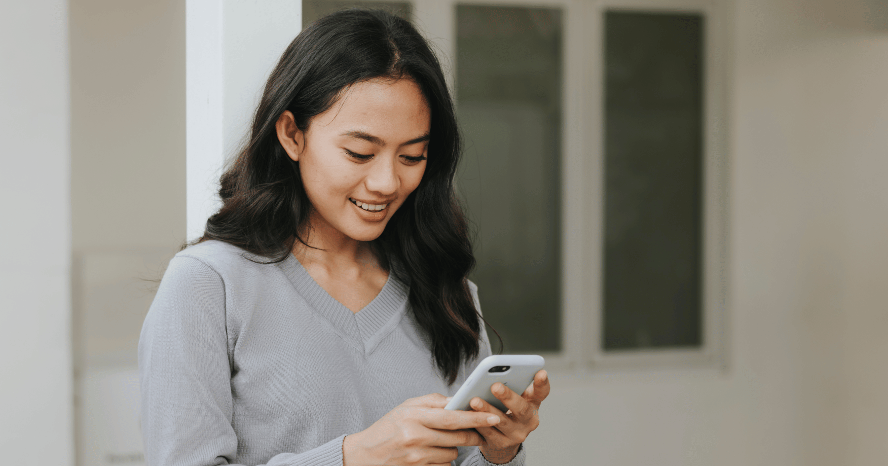 woman looking at a phone